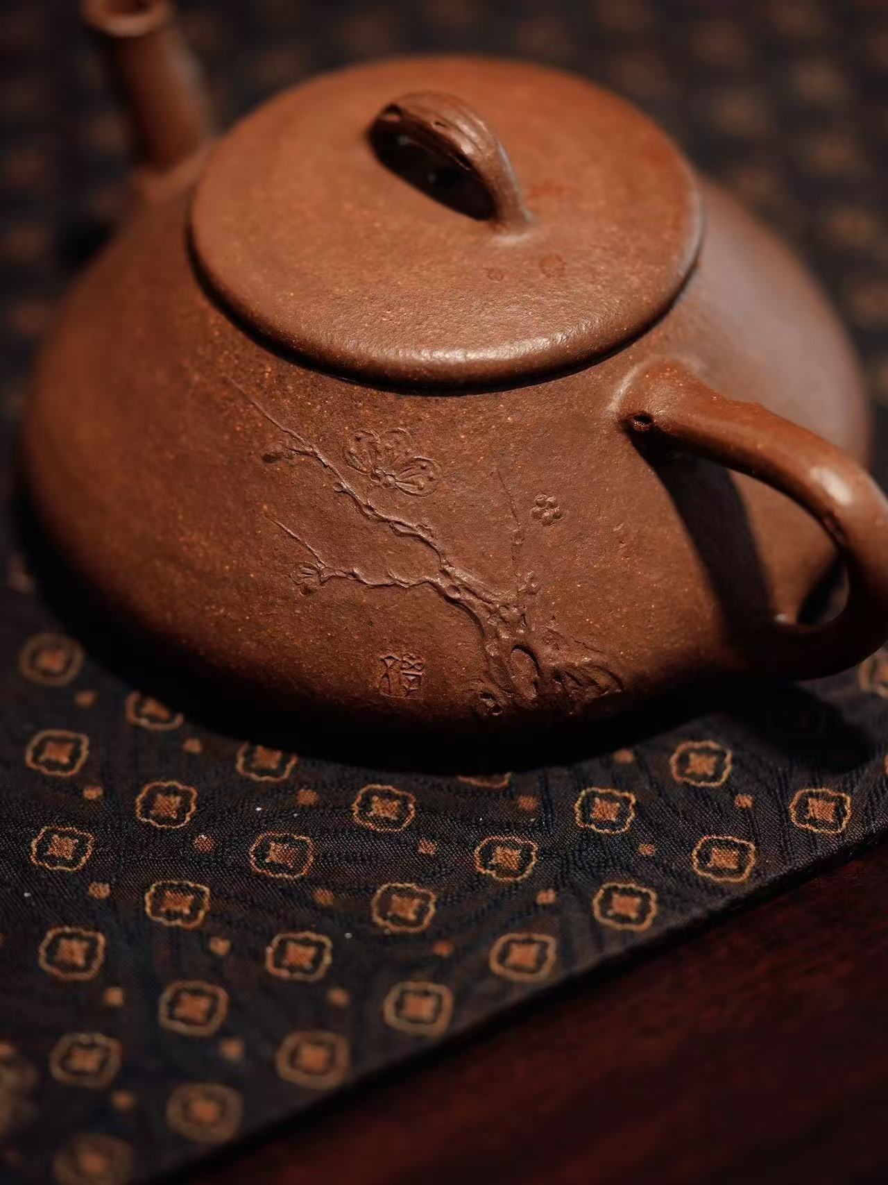 Wood-fired teapot with incised plum